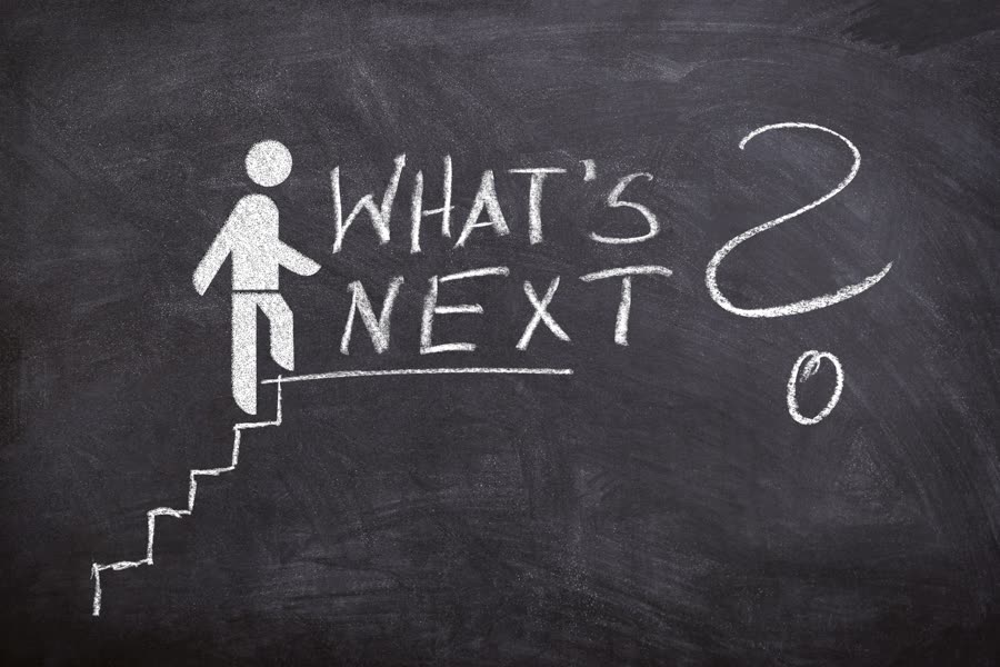 What's Next? Illustration of a figure climbing a set of chalkboard-drawn stairs.